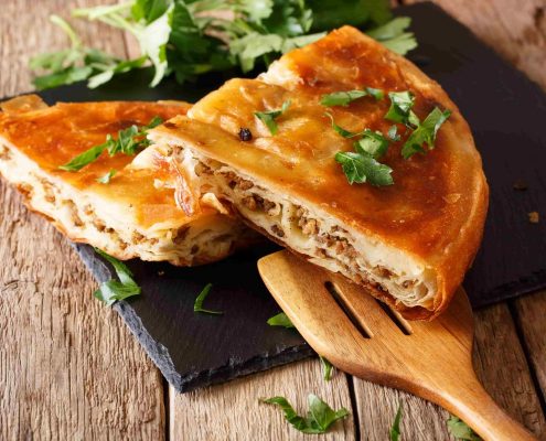 Delicious-appetizer-Balkan-burek-with-minced-meat-close-up-min Delicious-appetizer-Balkan-burek-with-minced-meat-close-up-min